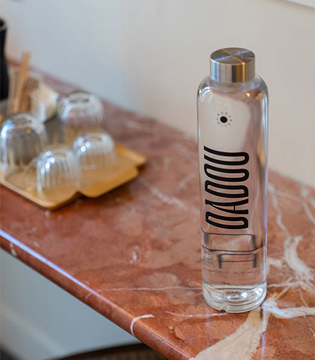 Detail of glass bottles at DADOU hotel Paris 17